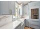 Bright kitchen with custom cabinets, marble countertops, and a farmhouse sink at 116 Peninsula Dr, Ravenel, SC 29470