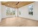 Bright living room with wood ceiling, large windows and trim details at 116 Peninsula Dr, Ravenel, SC 29470