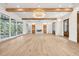 Expansive living room with wood beams, fireplace, built-ins, and glass doors, offering great views at 116 Peninsula Dr, Ravenel, SC 29470