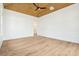 Bright living room with wood ceiling, large windows and trim details at 116 Peninsula Dr, Ravenel, SC 29470