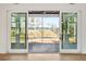 Patio view through sliding glass doors, offering a scenic outdoor vista and indoor-outdoor living at 116 Peninsula Dr, Ravenel, SC 29470