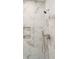 Close-up of a tiled shower featuring a rainfall showerhead, handheld sprayer and built-in niche at 116 Peninsula Dr, Ravenel, SC 29470