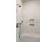 Close-up of a tiled shower with a rainfall showerhead and built-in niche at 116 Peninsula Dr, Ravenel, SC 29470