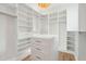 Spacious walk-in closet featuring ample shelving and a center island for organization at 116 Peninsula Dr, Ravenel, SC 29470