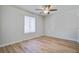 Bedroom featuring a ceiling fan, window and wood floors at 117 Lewisfield Dr, North Charleston, SC 29418