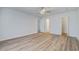 Bedroom with hardwood floors, doors leading to different rooms and closets at 117 Lewisfield Dr, North Charleston, SC 29418