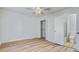 Bedroom with wood floors, ceiling fan, closet and adjacent bathroom at 117 Lewisfield Dr, North Charleston, SC 29418