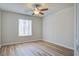 Bedroom featuring wood floors, a ceiling fan, and a window with blinds at 117 Lewisfield Dr, North Charleston, SC 29418