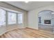 Inviting dining area features a bay window, hardwood floors, and an arched entryway to the living area at 117 Lewisfield Dr, North Charleston, SC 29418