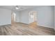 Open-concept living room with bright walls and new wood-look flooring at 117 Lewisfield Dr, North Charleston, SC 29418