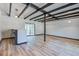 Open-concept living room featuring exposed beams and wood floors at 117 Lewisfield Dr, North Charleston, SC 29418