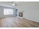 Spacious living room featuring a decorative fireplace, ceiling fan, and wood-look flooring at 117 Lewisfield Dr, North Charleston, SC 29418