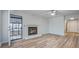 Bright living room with fireplace, wood-look flooring, and an adjacent foyer at 117 Lewisfield Dr, North Charleston, SC 29418