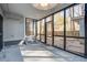 Enclosed sunroom features tiled floor, screened windows and an ornate secure door leading to the backyard at 117 Lewisfield Dr, North Charleston, SC 29418