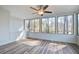 Sunroom featuring windows, ceiling fan, and hardwood floors at 117 Lewisfield Dr, North Charleston, SC 29418