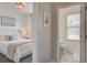 View from the bedroom towards an adjacent bathroom with a window and blue vanity at 123 Hyacinth St, Summerville, SC 29483
