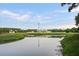 Scenic view of the community clubhouse reflecting on the calm pond waters at 123 Hyacinth St, Summerville, SC 29483