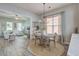 Inviting dining area seamlessly connected to the cozy living room, showcasing the open-concept design at 123 Hyacinth St, Summerville, SC 29483