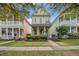 Charming yellow two-story home with a welcoming front porch and beautifully landscaped front yard at 123 Hyacinth St, Summerville, SC 29483
