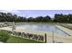 A large community pool with plenty of lounge chairs and umbrellas for relaxing and enjoying the sun at 123 Hyacinth St, Summerville, SC 29483