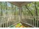 Covered balcony offers view of surrounding trees with a ABC play mat at 1271 Dingle Rd, Mount Pleasant, SC 29466