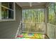 Screened balcony offers a serene view of the surrounding trees and nature at 1271 Dingle Rd, Mount Pleasant, SC 29466