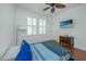 Bright bedroom features hardwood floors, ceiling fan and a wall-mounted television at 1271 Dingle Rd, Mount Pleasant, SC 29466