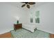 Comfortable bedroom featuring wood floors, a ceiling fan, and large windows at 1271 Dingle Rd, Mount Pleasant, SC 29466