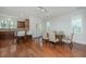 Inviting dining area with hardwood floors, natural light, access to kitchen, and views of the outdoors at 1271 Dingle Rd, Mount Pleasant, SC 29466