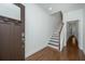 Welcoming foyer with hardwood floors, staircase, white walls, and modern door hardware creating a bright space at 1271 Dingle Rd, Mount Pleasant, SC 29466