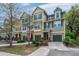 Inviting townhomes featuring individual garages, manicured greenery, and cozy front entrances add community charm at 1271 Dingle Rd, Mount Pleasant, SC 29466