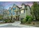 Attractive townhomes featuring varied siding, private garages, and manicured landscaping create curb appeal at 1271 Dingle Rd, Mount Pleasant, SC 29466