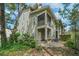 Exterior view showcases the backyard, including a screened porch with backyard access at 1271 Dingle Rd, Mount Pleasant, SC 29466