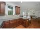 Open kitchen features granite countertops, wood floors, and seamless access to the living area at 1271 Dingle Rd, Mount Pleasant, SC 29466