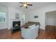 Cozy living room featuring hardwood floors, fireplace with mantel, and comfortable seating perfect for relaxation at 1271 Dingle Rd, Mount Pleasant, SC 29466