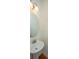 Simple powder room features a pedestal sink and a round mirror at 1271 Dingle Rd, Mount Pleasant, SC 29466