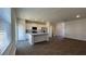 Modern kitchen with island, stainless steel appliances, and sleek countertops open to living space at 135 Yarrow Way, Moncks Corner, SC 29461