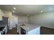 Kitchen featuring an island, stainless steel appliances, granite countertops, and access to adjacent living space at 135 Yarrow Way, Moncks Corner, SC 29461