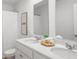 Bright bathroom featuring double vanity, white cabinets, and a shower with curtain at 137 Yarrow Way, Moncks Corner, SC 29461