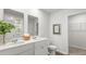 Well-lit bathroom featuring double vanity, white cabinets, and a framed mirror at 137 Yarrow Way, Moncks Corner, SC 29461