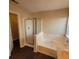 This bathroom features a tub and shower, with a door leading to the closet at 1391 Center Lake Dr, Mount Pleasant, SC 29464