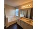 Bright bathroom featuring a soaking tub, double sink vanity, and a shower at 1391 Center Lake Dr, Mount Pleasant, SC 29464