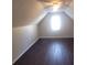 Bedroom with angled ceiling, dark floors and bright window at 1391 Center Lake Dr, Mount Pleasant, SC 29464