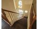 Bright entryway with wood stairs, a hanging light fixture and multiple windows that allow for ample natural light at 1391 Center Lake Dr, Mount Pleasant, SC 29464