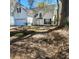 Charming home with an attached garage, a well-manicured lawn, and mature trees and shrubbery enhancing its curb appeal at 1391 Center Lake Dr, Mount Pleasant, SC 29464