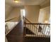 Hallway with wood-look floors and railings, leading to the lower floor at 1391 Center Lake Dr, Mount Pleasant, SC 29464