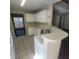 Functional kitchen featuring white cabinets, tile floors, and a tiled breakfast bar at 1391 Center Lake Dr, Mount Pleasant, SC 29464