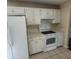 Kitchen featuring white cabinets, countertops, tile floors, and modern appliances at 1391 Center Lake Dr, Mount Pleasant, SC 29464