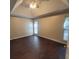 This main bedroom features dark wood-look flooring and a tray ceiling with a fan at 1391 Center Lake Dr, Mount Pleasant, SC 29464