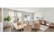 Bright dining area with sliding glass doors accessing backyard with open concept living room access at 141 Yarrow Way, Moncks Corner, SC 29461